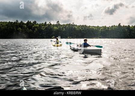 family kayaking on Flying Pond, Mount Vernon, Maine Stock Photo