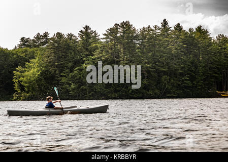 family kayaking on Flying Pond, Mount Vernon, Maine Stock Photo