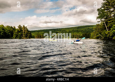 family kayaking on Flying Pond, Mount Vernon, Maine Stock Photo