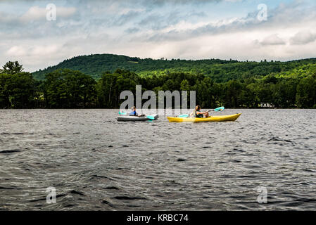 family kayaking on Flying Pond, Mount Vernon, Maine Stock Photo