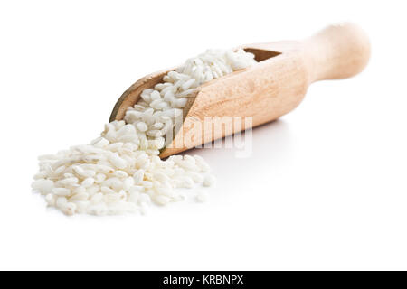 The arborio rice in wooden scoop. Stock Photo