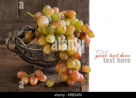 Grapes in silver bowl Stock Photo