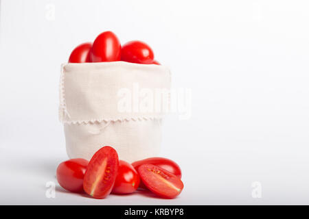 tomatoes in a bag isolated on a white background Stock Photo