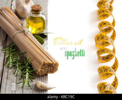 Whole wheat spaghetti, garlic, oilve oil and herbs Stock Photo