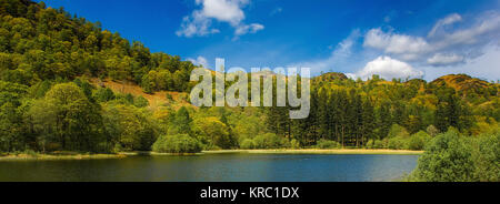 Panoramic view of Yew Tree Tarn, its a small lake in the English Lake District situated in between the towns of Ambleside and Coniston, 17th May 2005 Stock Photo