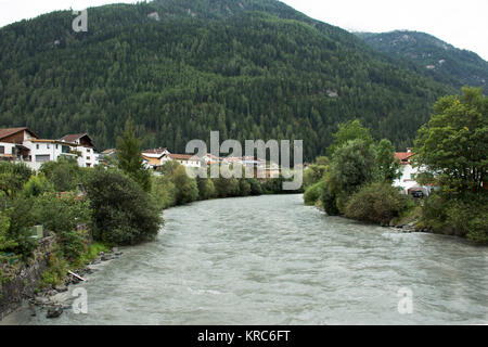 Flowing and motion of water very fast from rainstrom in Bad inn river at Pfunds village in evening time in Tyrol, Austria