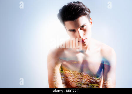 Handsome young man thinking about mountains Stock Photo