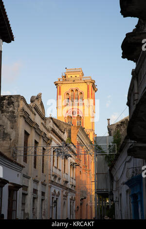 Sunset lights up the church at the end of a street in Cartagena old town Stock Photo