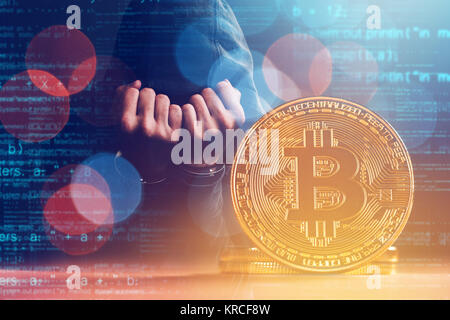 Handcuffed arrested Bitcoin thief in jail, conceptual image Stock Photo