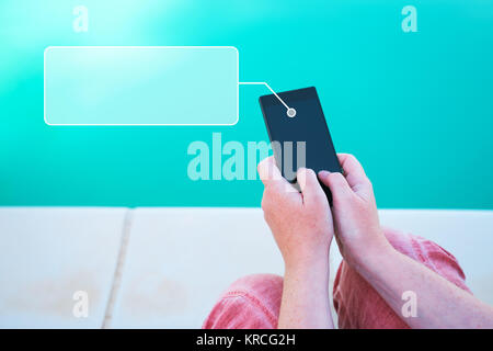 Using mobile phone by the swimming pool, female hands holding smartphone with copy space for text message Stock Photo