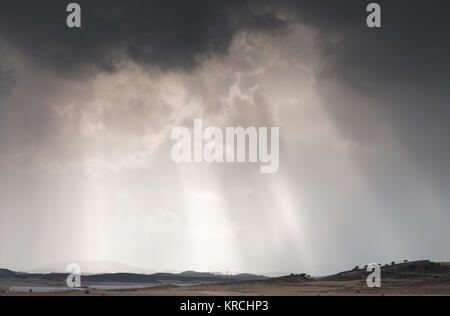 Sun rays between dramatic stormy clouds Stock Photo - Alamy