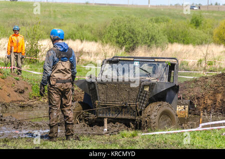 SALOVKA, RUSSIA - MAY 5, 2017: Offroad 4x4 car driving through mud and water on annual offroad 4x4 car race Stock Photo