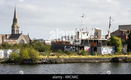 Dublin, Ireland - September 17, 2016: The Naomh Eanna, in derelict conditions, in the Grand Canal Dock in Dublin's Docklands district.