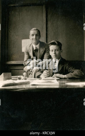 Two young clerks in an office Stock Photo