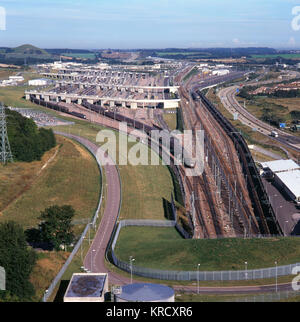 The Channel Tunnel terminal at Folkestone, Kent, England - view from above the tunnel entrance, showing a Eurostar train leaving. Stock Photo