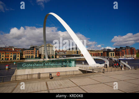 The Gateshead Millennium Bridge. A pedestrian and cyclist tilt bridge spanning the River Tyne Gateshead on the south bank, and the Quayside of Newcastle upon Tyne on the north bank. The award-winning structure was conceived and designed by architects Wilkinson Eyre and structural engineers Gifford. The bridge is often referred to as the 'Winking Eye Bridge' due to its elliptical shape and its rotational movement. Stock Photo