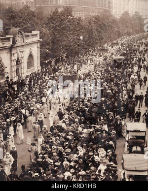A large suffragette procession passing along the Embankment in Central London.  The Coronation of George V in 1911 inspired the WSPU (Womens' Social and Political Union) to organise its own spectacular coronation pageant.  The four mile procession culminated in a rally at the Royal Albert Hall and involved over 60,000 delegates dressed in national and historical costume, some of them carrying banners and placards.       Date: 17 June 1911