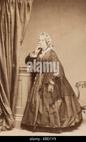 Victorian woman in a crinoline dress Stock Photo