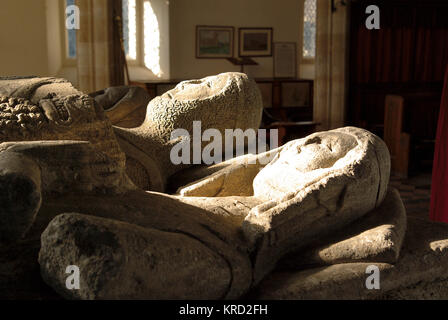 Effigies on a tomb in the church of St Michael the Archangel in the village of Laxton, Nottinghamshire.  The church dates back to the 12th century. Stock Photo