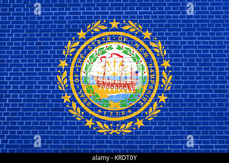 Flag of New Hampshire, brick wall texture backdrop Stock Photo