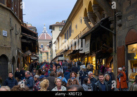 Florence, Italy, jewelry shops on Ponte Vecchio with shoppers Stock Photo