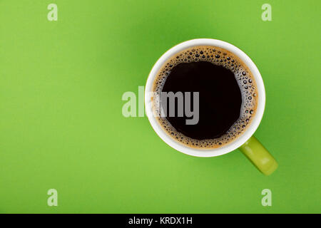 Americano black coffee in full big cup on green Stock Photo