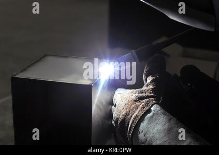 welder works in a metal construction company Stock Photo