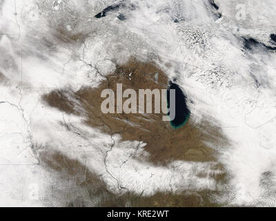 <p>In the Upper Midwest and the Ohio Valley, a major winter snow storm heralded the arrival of spring in the United States. When the storm clouds cleared over the area southwest of Lake Michigan on March 22, 2006, the Moderate Resolution Imaging Spectroradiometer  modis.gsfc.nasa.gov (MODIS)  on NASA's  aqua.nasa.gov Aqua  satellite captured this image of the swath of snow across the region.  Two swaths of snow are visible in the image. One cuts across the top left corner, northeastward through Minnesota into Wisconsin. The second swath passes southeastward, through Iowa, Missouri, Illinois, a Stock Photo