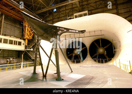 Researchers are testing a 21-foot wingspan prototype of the X-48B, a blended wing body aircraft, at the full scale wind tunnel at NASA’s research center at Langley Air Force Base, Va. The Air Force Research Laboratory partnered with Boeing Phantom Works and the National Aeronautics and Space Administration to study the structural, aerodynamic and operational advantages of the advanced aircraft concept. (NASA photo/Jeff Caplan) X 48B model in wind tunnel Stock Photo