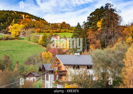 Rural homes and pastures with fall foliage color near Funes, Italy, Europe. Stock Photo