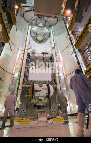 In Atlantis’ payload bay, STS-98 crew member Robert Curbeam practices ...