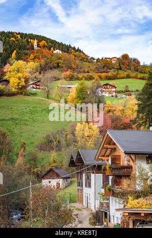 Rural homes and pastures with fall foliage color near Funes, Italy, Europe. Stock Photo