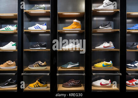 Sneakers shoes shelves of a store, Stock Photo - Alamy