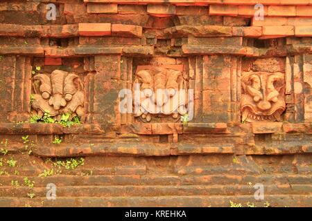 Kirtimukha (Kala) faces on a temple in Group G. My Son Temple World Heritage Site, Quang Nam Province, Central Vietnam near Da Nang Stock Photo