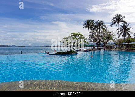 Kota Kinabalu, Malaysia - February 18, 2017: Beautiful infinity pool at Shangri-La Hotel and Resort in Sabah Borneo, Malaysia. Stock Photo