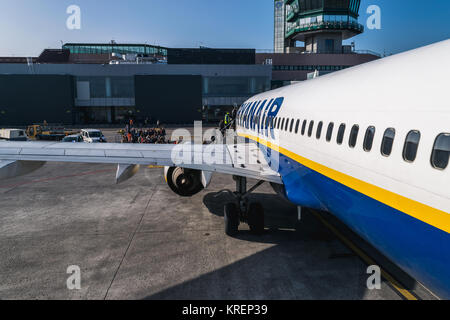 BOLOGNA, ITALY – FEBRUARY 2016: Passengers boarding Ryanair jetliner at the Bologna airport, Italy to Bucharest, Romania. Ryanair Ltd. is an Irish low Stock Photo