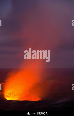 The Kilauea Volcano eruption glows during the blue hour between twighlight and night in Hawaii Volcanoes National Park. Hawaii, Big Island. USA Stock Photo