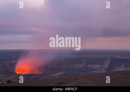 The Kilauea Volcano eruption glows during the blue hour between twighlight and night in Hawaii Volcanoes National Park. Hawaii, Big Island. USA Stock Photo