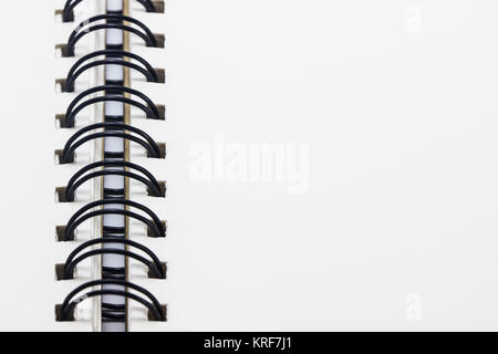 Close up open notebook and black iron rope with copy space for input text. Stock Photo
