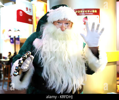 Tokyo, Japan. 19th Dec, 2017. Green Santa Claus smiles as he visits the Kidzania career theme park in Tokyo on Tuesday, December 19, 2017. Green Santa Claus from Denmark is now in Japan as a ecology goodwill ambassador. Credit: Yoshio Tsunoda/AFLO/Alamy Live News Stock Photo