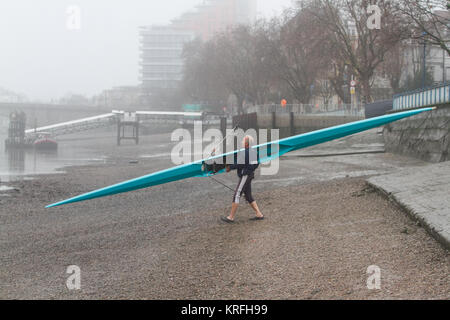 London, UK. 20th Dec, 2017. A rower takes to the water on the River Thames in Putney on a cold misty morning Credit: amer ghazzal/Alamy Live News Stock Photo