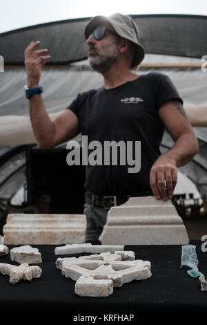 Bet Shemesh, Israel. 20th December, 2017. Remains of a Byzantine Period 1,500 year old monastery and church decorated with mosaic floors and imported marble elements uncovered in Bet Shemesh by the Israel Antiquities Authority. Archaeologists continue to uncover more of remains of walls built of large worked stone masonry and a marble pillar base decorated with crosses.  A mosaic floor is decorated with birds, leafs, and pomegranates outstandingly preserved. Credit: Nir Alon/Alamy Live News Stock Photo