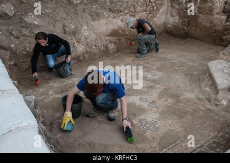 Bet Shemesh, Israel. 20th December, 2017. Archaeologists and workers of the Israel Antiquities Authority continue to uncover more remains of a Byzantine Period 1,500 year old monastery and church decorated with mosaic floors and imported marble elements uncovered in Bet Shemesh. Discovered are remains of walls built of large worked stone masonry and a marble pillar base decorated with crosses. Credit: Nir Alon/Alamy Live News Stock Photo