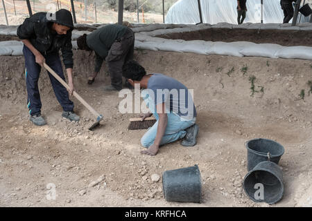 Bet Shemesh, Israel. 20th December, 2017. Archaeologists and workers of the Israel Antiquities Authority continue to uncover more remains of a Byzantine Period 1,500 year old monastery and church decorated with mosaic floors and imported marble elements uncovered in Bet Shemesh. Discovered are remains of walls built of large worked stone masonry and a marble pillar base decorated with crosses. Credit: Nir Alon/Alamy Live News Stock Photo