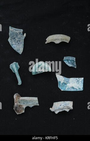 Bet Shemesh, Israel. 20th December, 2017. Glass artifacts discovered on the site of the remains of a Byzantine Period 1,500 year old monastery and church. Decorated with mosaic floors and imported marble elements the compound was uncovered near Bet Shemesh by the Israel Antiquities Authority. Archaeologists continue to uncover more of remains of walls built of large worked stone masonry and a marble pillar base decorated with crosses. Credit: Nir Alon/Alamy Live News Stock Photo