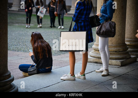 Milan, Italy - September 24, 2017: Tourist With A Gucci Shopping Bag During  Fashion Week. Stock Photo, Picture and Royalty Free Image. Image 93825493.
