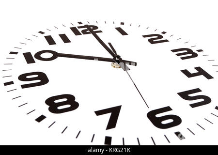 Clock isolated on white marking the ten o'clock hour. The main focus is in the hour hand. Stock Photo
