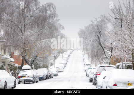 A snow-covered street with no moving traffic in the North London suburb of Muswell Hill. Stock Photo