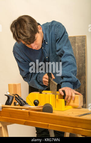 worker man working on wood taking measures Stock Photo