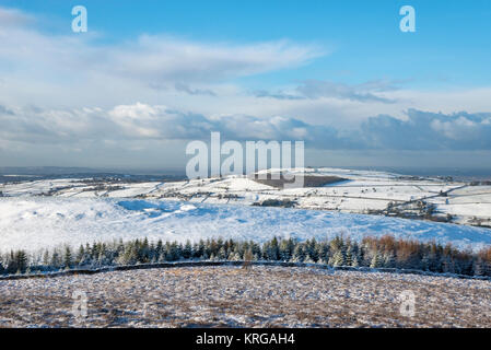 View towards Cheshire from hills near Rowarth, Derbyshire, England. A  beautiful snowy morning. Stock Photo